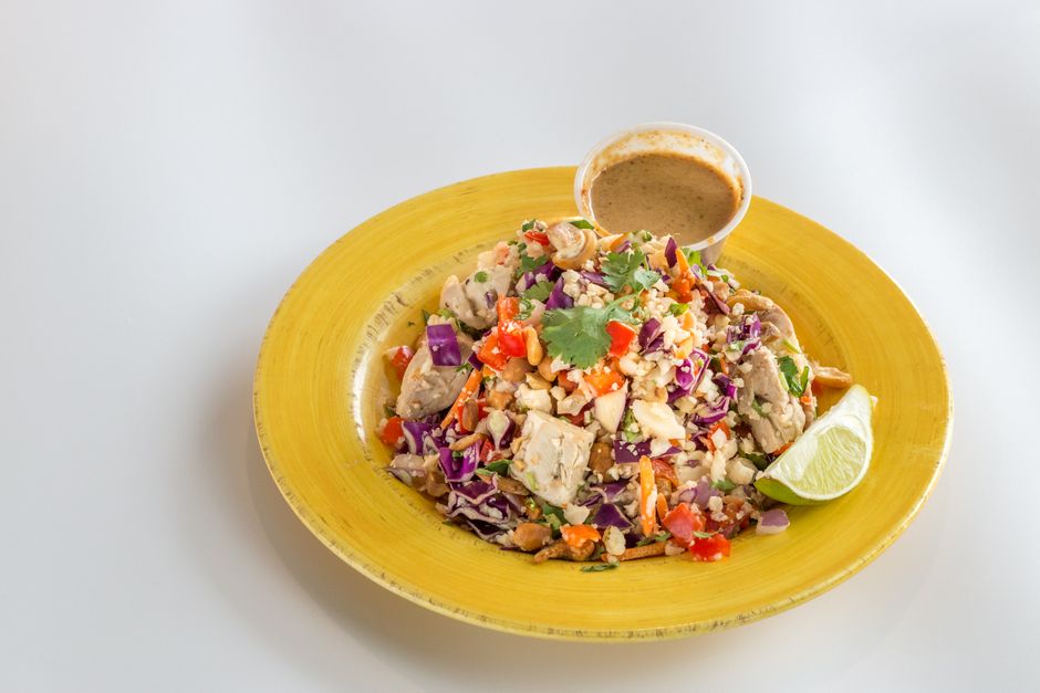 Colorful salad with lime and dressing, perfect for healthy eating.